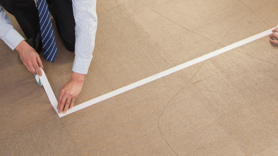 Picture of taping the floor.
