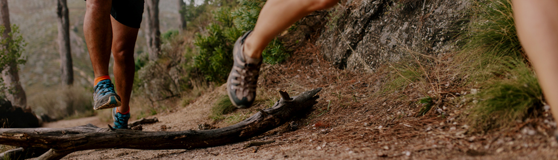 legs of runners on the trail